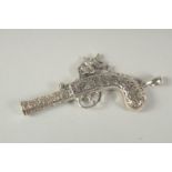 A novelty silver pistol whistle, 6cm.
