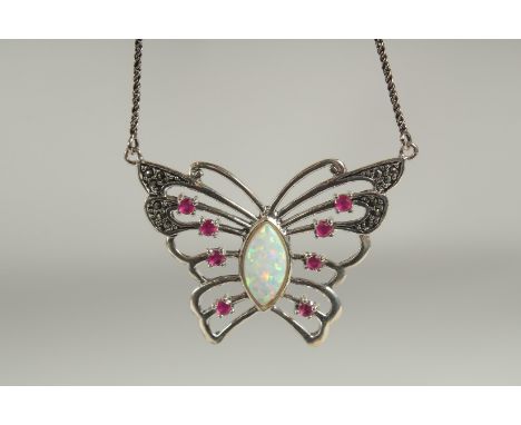 A silver opal ruby butterfly pendant and chain in a box.