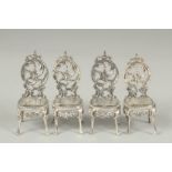 A set of four novelty silver salon chairs.