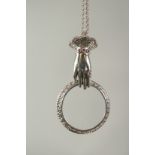 A silver ruby set hand spy glass and chain in a box.