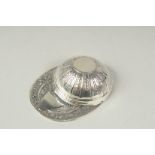 A silver jockeys cap caddy spoon.