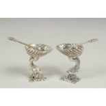 A good pair of silver dolphin salts and spoons, 3.5cm.