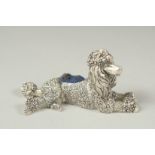 A silver plated poodle pin cushion, 8cm long.