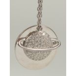 A silver plated pendant and chain in a box.