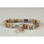 A Scottish silver tigers eye bracelet in a velvet box.