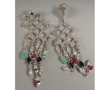 A pair of silver ruby sapphire and emerald chandelier drop earrings in a box.