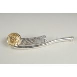 A silver gilt Bosons whistle.