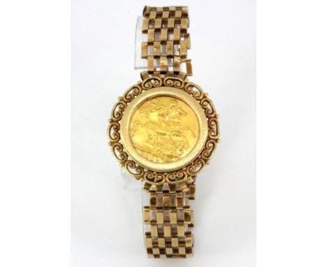 A 9ct yellow gold gate bracelet mounted with a full sovereign, approx. 22.5g overall.