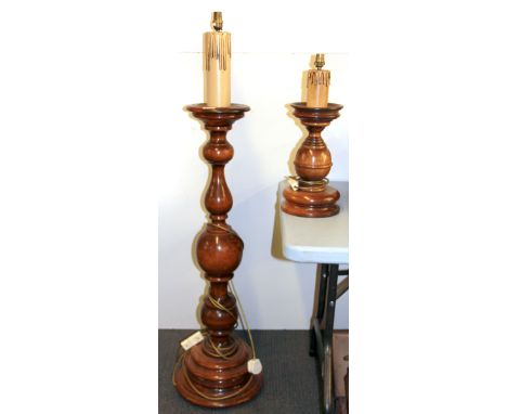 A turned wood candle style standard lamp, H. 133cm, together with a matching table lamp.