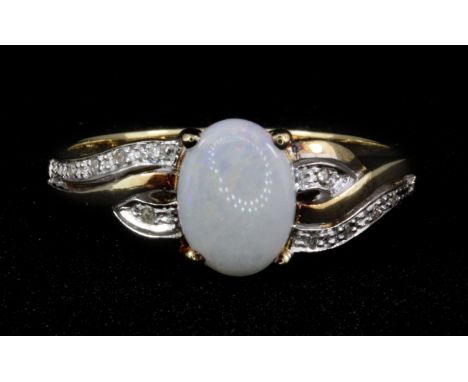 A 9ct yellow gold opal and diamond set ring, (O.5).