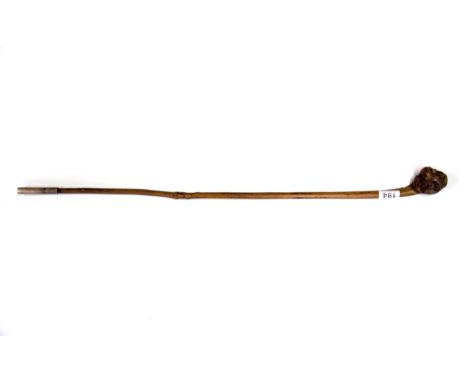 A carved wooden monkey handled walking stick with glass eyes, head H. 6cm.