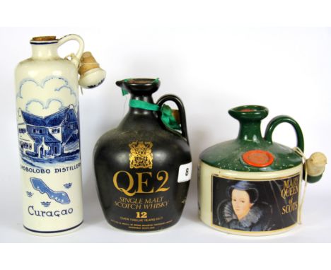 A vintage bottle of QE2 single malt Scotch whiskey, together with a bottle of Queen Mary of Scots whisky and a bottle Curacao