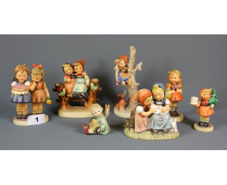 A group of Hummel child figurines.