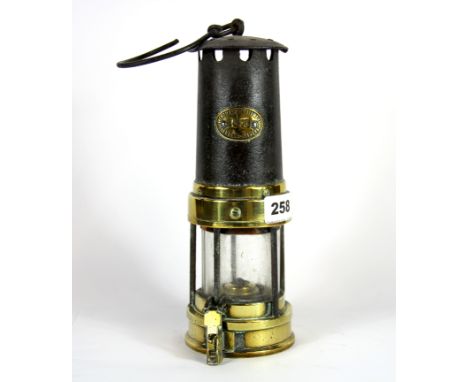 An early brass miners lamp by E. Thomas & Williams, H. 26cm.