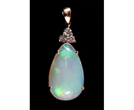 A 14ct yellow gold (stamped 585) pendant set with a large cabochon cut opal (approx. 9.11ct) and three brilliant cut diamonds