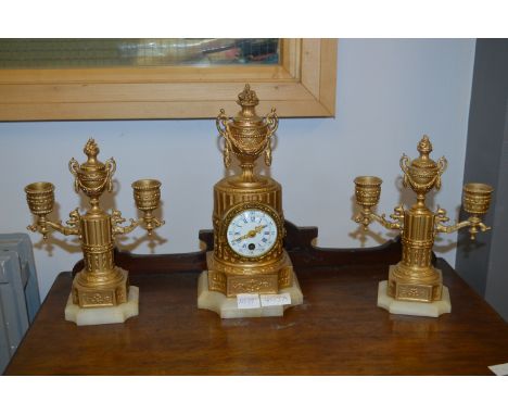 French Gilt Mantel Clock and a Pair of Candlestick Garnitures
