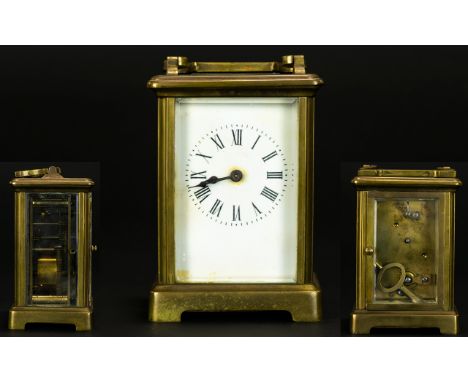 Antique Period English Brass Carriage Clock. Features Glass Panels, Visible Escapement, Porcelain Dial, Black Numerals Marker