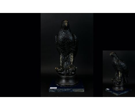 A Vintage Bronzed Plaster Figure In The Form Of An American Eagle Raised on circular base attached to square silestone plinth