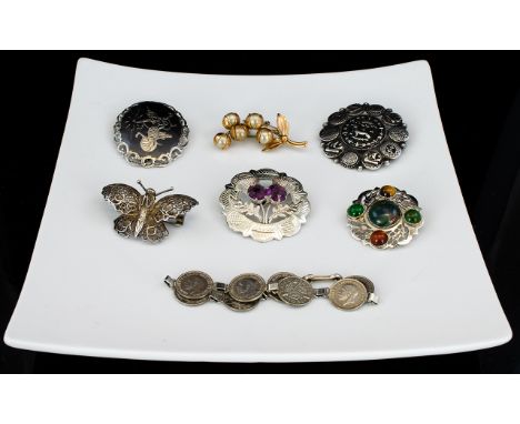 A Collection Of Antique And Vintage Silver And Mixed Metal Jewellery Seven items in total to include Thai silver brooch with 