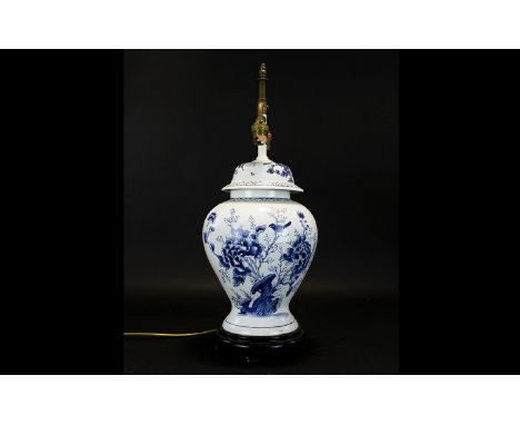 Oriental Style Ceramic Lamp Base Of urn form with traditional hand painted Delft style floral and foliate design, raised on f