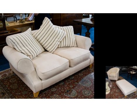 A Modern Two Seater Sofa Plush sofa upholstered in natural textured fabric. Complete with large scatter cushions. Also matchi