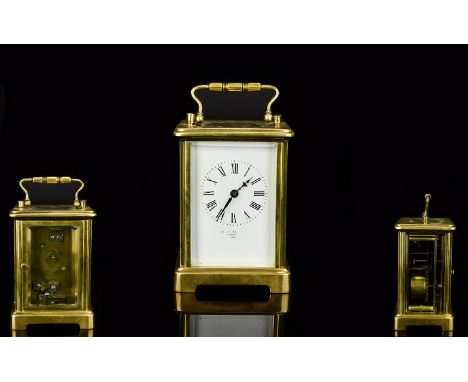 A Brass 4.5 Inch Tall Carriage Clock with Bevelled Glass, In Good Order and Working Condition, Complete with Original Key. 