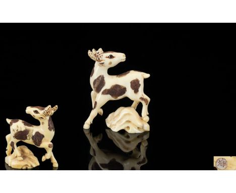 Oriental Carved Ivory Netsuke In the form of a deer,character marks to base, approx 1.5 inches in height.