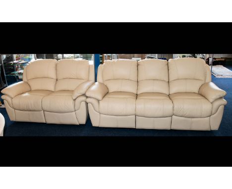 A Contemporary Leather Suite Comprising one three seater sofa and one two seater sofa. Each of plain form in stitched cream l