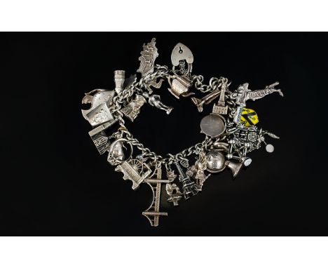 A Vintage Good Quality Silver Charm Bracelet Loaded with Over 30 Charms. All Fully Hallmarked for Silver - Please See Photo. 