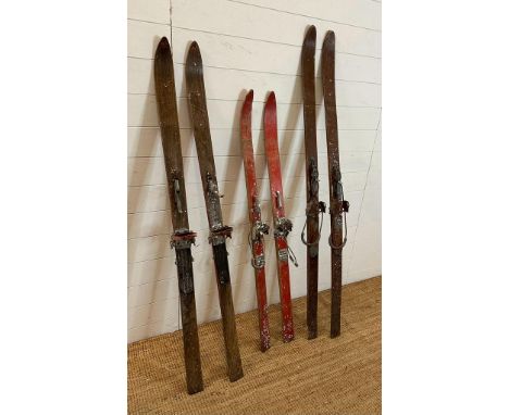 Three pairs of vintage wooden skis 