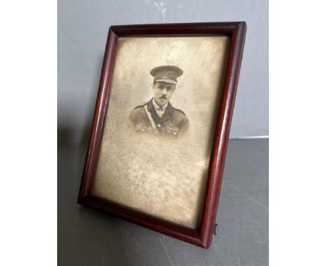A portrait of a WWI medical Corp officer in an easel back frame 