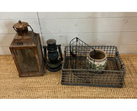A selection of items to include two lanterns a ceramic pot and two wire items
