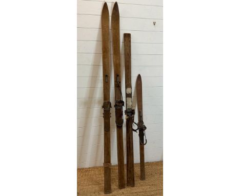 A selection of four vintage wooden skis 