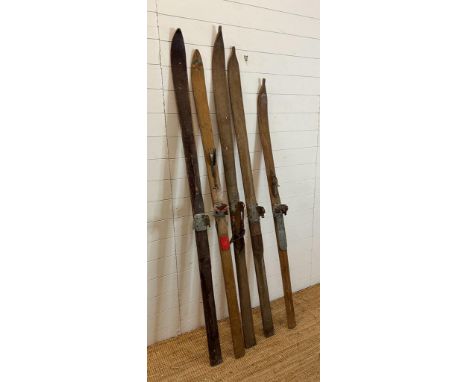 A selection of five vintage wooden skis 