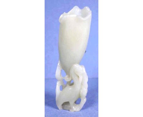 Chinese carved jade figure depicting a crane, lotus and flower, 12.5cm high
