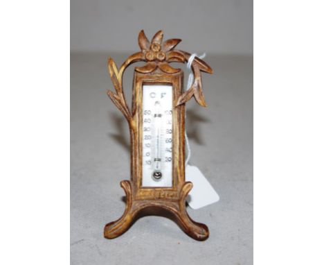 Vintage carved wood thermometer with strut verso. (Small loss to top right corner). Height 11cm approx.