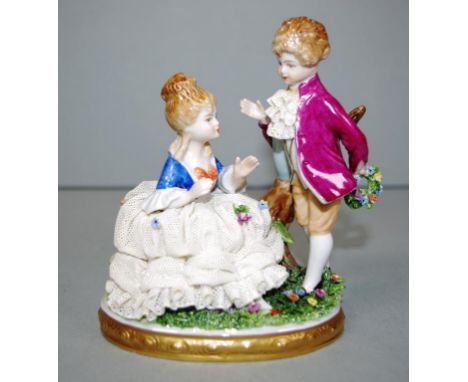 German ceramic courting couple figure marked to base 'Unter Weiss Bach.' Height 14cm approx.
