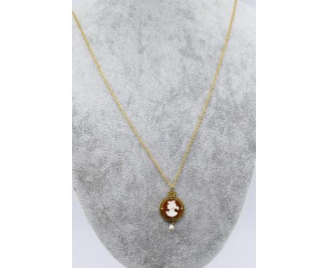 Gold, cameo and pearl pendant on chain 10k F&B marked to pendant. approx 3.6 grams total weight, 62cm chain length. 9ct frame