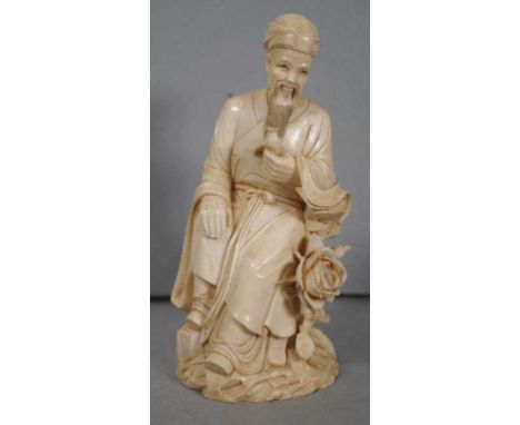 Chinese late Qing (1880-1912) carved ivory figure of a sage, seated with a rose to his side and a rosebud in his hand, 17cm h