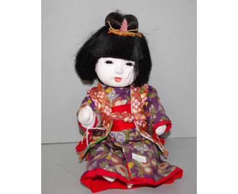 Vintage Japanese doll dressed in kimono. Height 29cm approx.