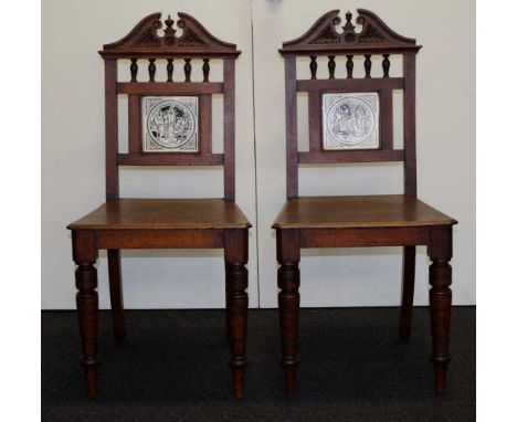 Pair of Edwardian oak butler's chairs with Minton Shakespearean tile backs, 91.5cm high