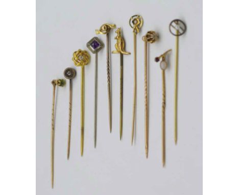 A collection of gold and gemstone stick pins includes antique, 9ct, 14k, 15ct, diamond and gem set and a figural kangaroo exa