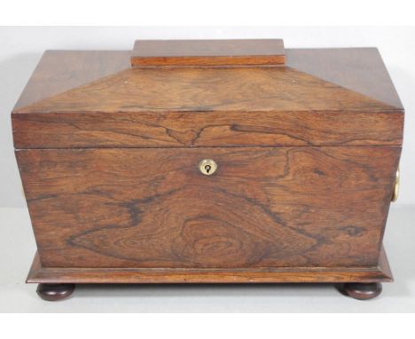 Large Regency dark rosewood sarcophagus caddy with large brass ring handles, bun feet and triple section interior with mixing