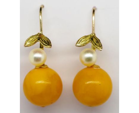 Amber and pearl and gold earrings 12mm butter scotch amber beads set on 9ct shepherd hooks.