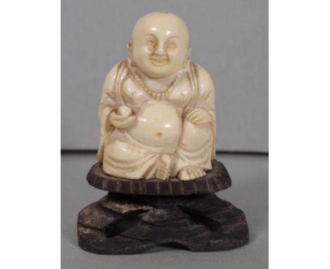 Chinese late Qing (1880-1912) carved ivory Buddha on wooden stand, 8.5cm high. Provenance: Sold by Davidson Auctions, Sydney,