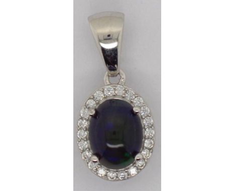 Black opal and sterling silver pendant 7.5mm x 6mm black opal cabochon set in a sterling silver pendant set with a crytsla ha