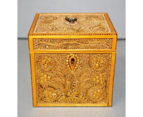 George III rolled paper filigree tea caddy the hinged cover mounted silvered pierced handle, each panel in the form of stylis