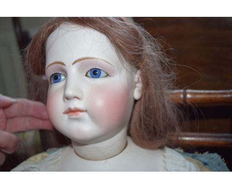 19th century french bisque swivel head fashion doll, with finely painted features, blue glass eyes, closed mouth, applied pie