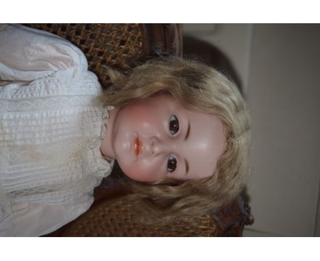 Kammer & Reinhardt 117A bisque head character doll, with weighted brown glass eyes, painted lower lashes and feathered brows,