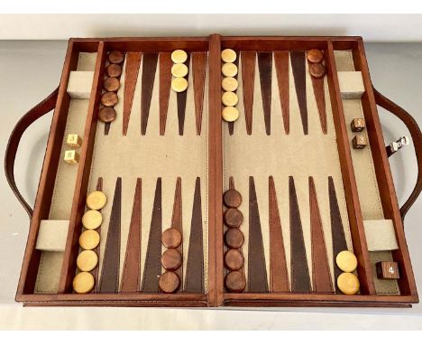 BACKGAMMON SET, in a leathered case 7cm x 40cm x 23cm. 